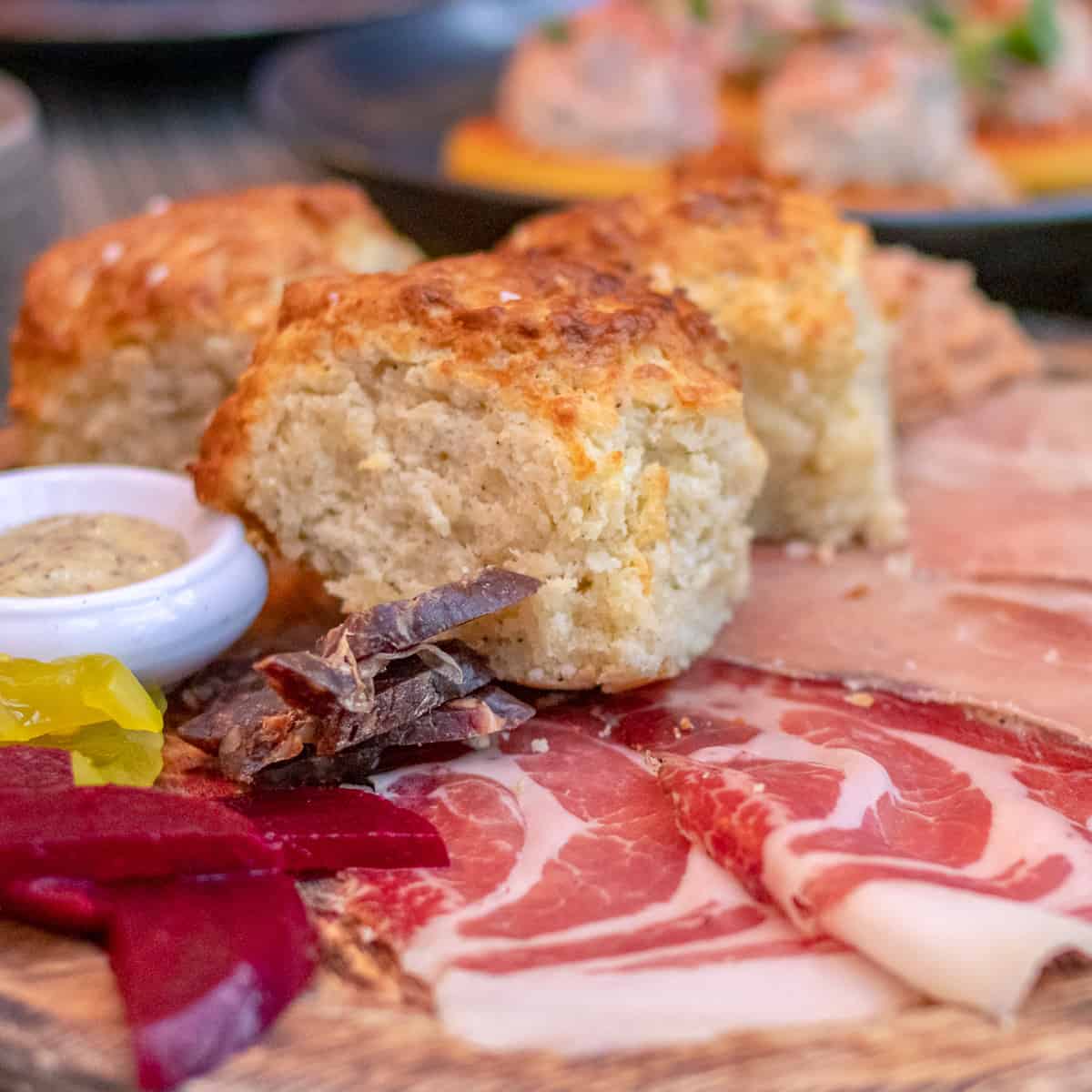 A Plate of Tennessee Charcuterie and Cheddar Biscuits from husk