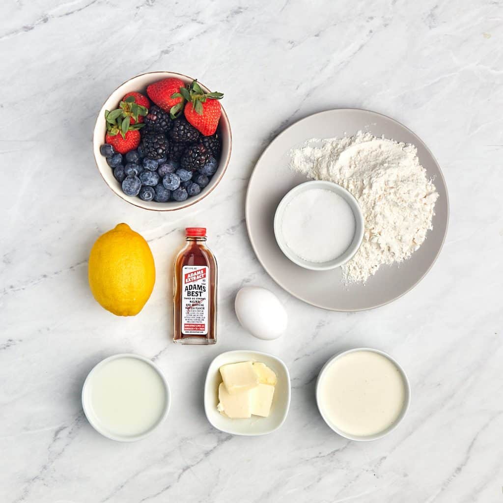 image of ingredients for crepes with whipped cream and mixed berreis