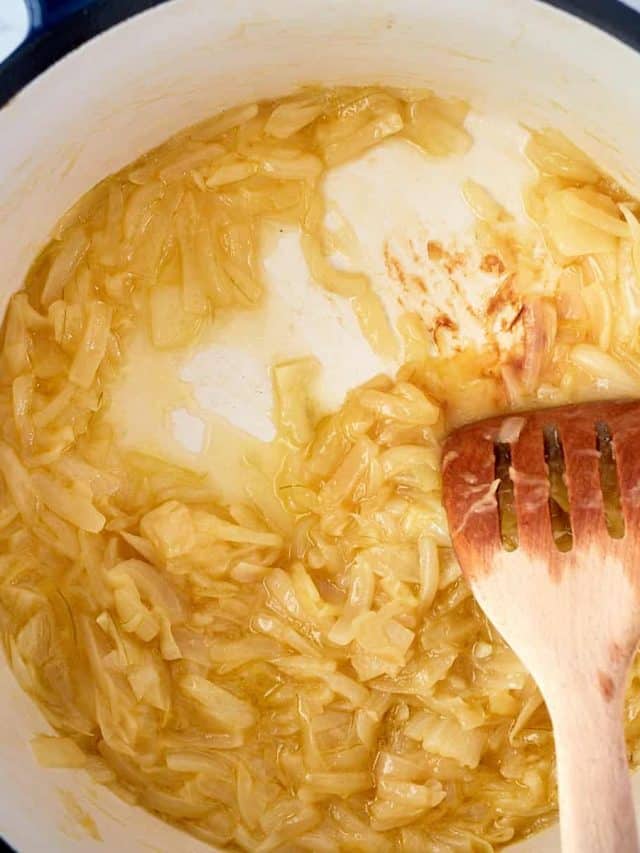 onions being caramelized in a large saucepan
