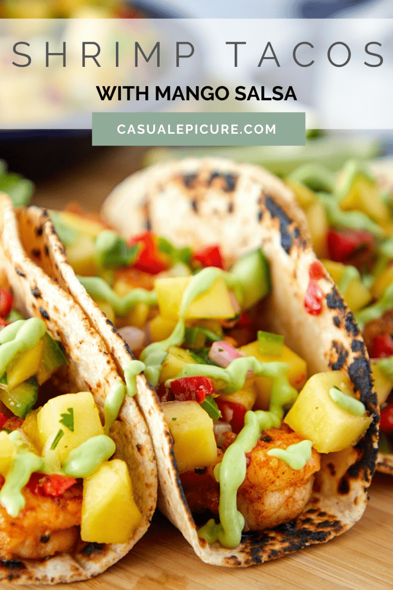 pinterest pin for shrimp tacos with mango salsa. image links to post with recipe