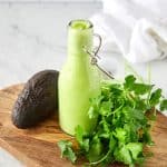 creamy cilantro avocado dressing in a serving bottle