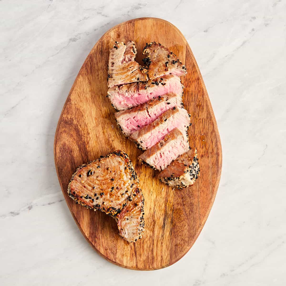 tuna steak on cutting board cut against the grain