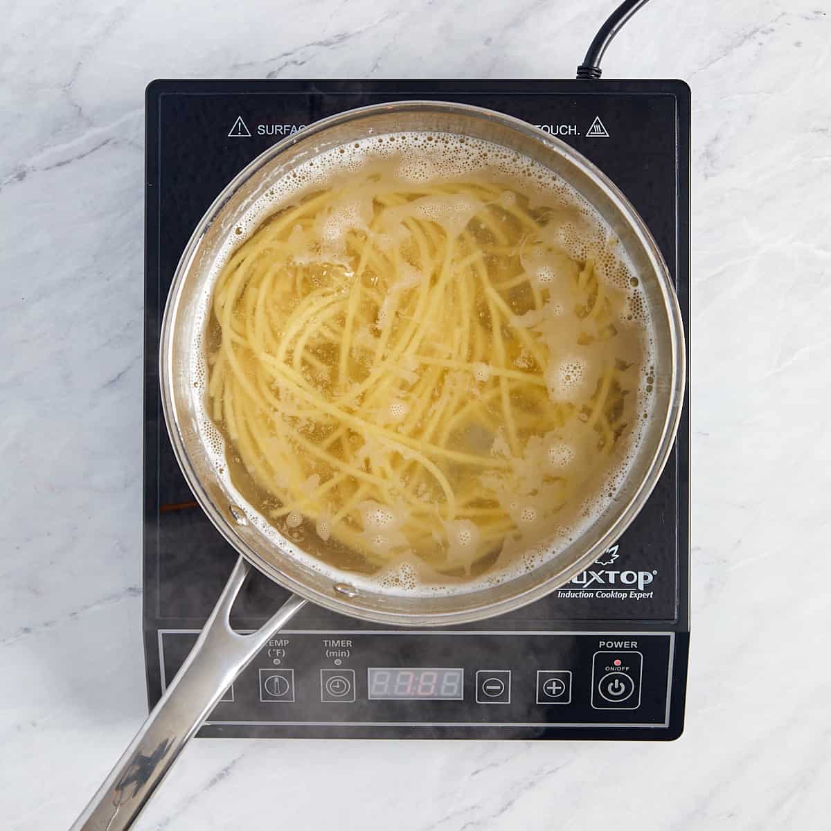 pasta cooking in a pot of water