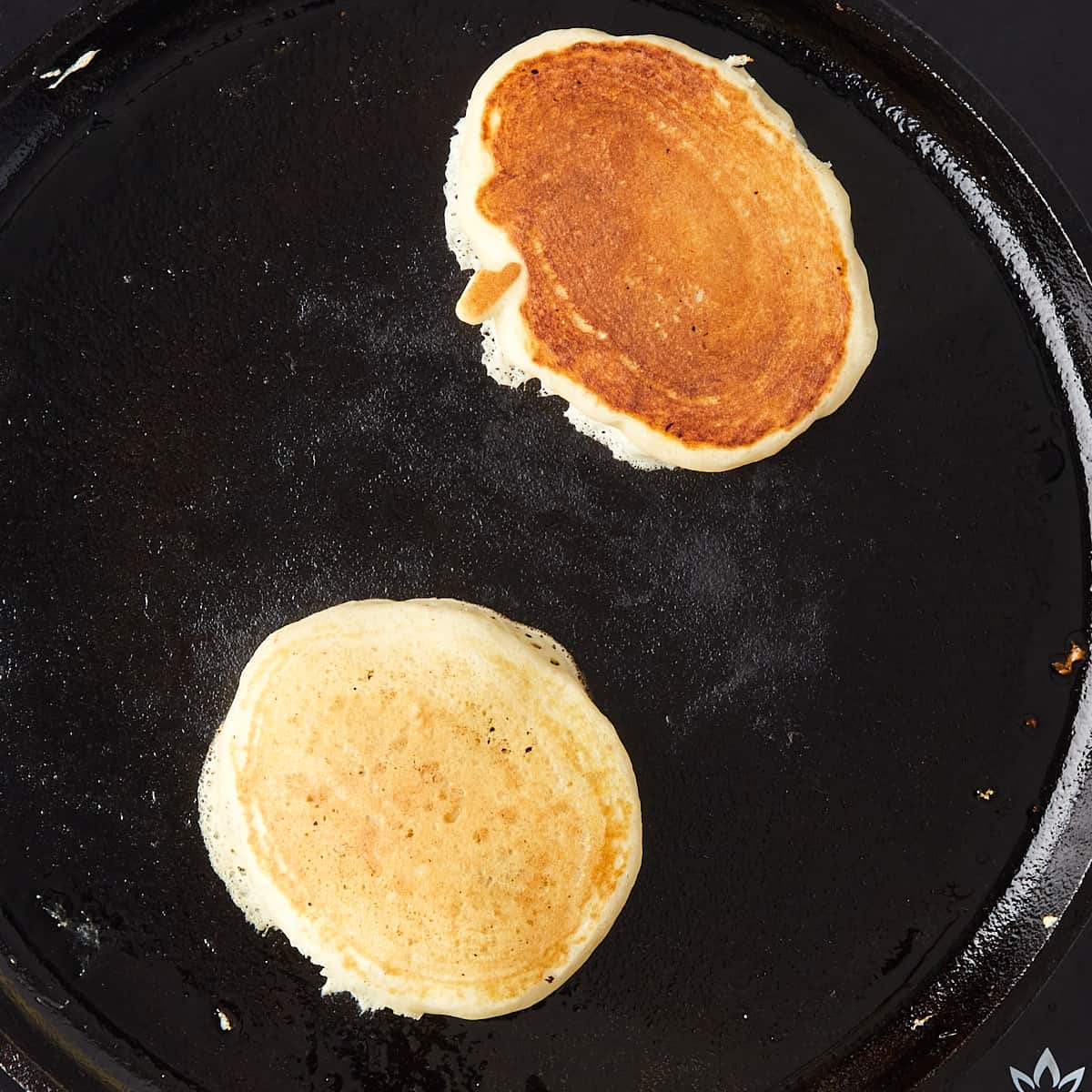 pancakes being cooked on a pan
