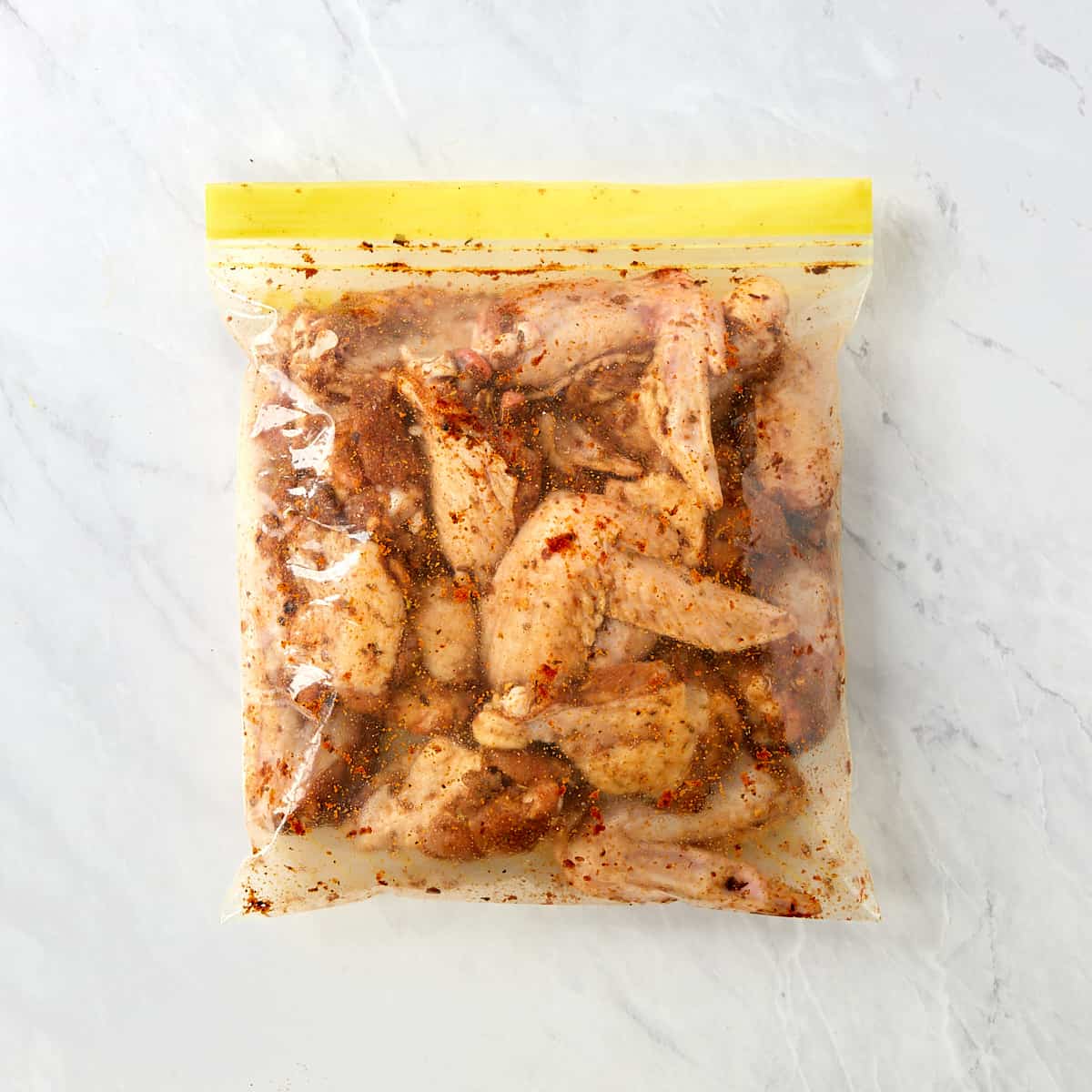 wings in a a bag covered with spices