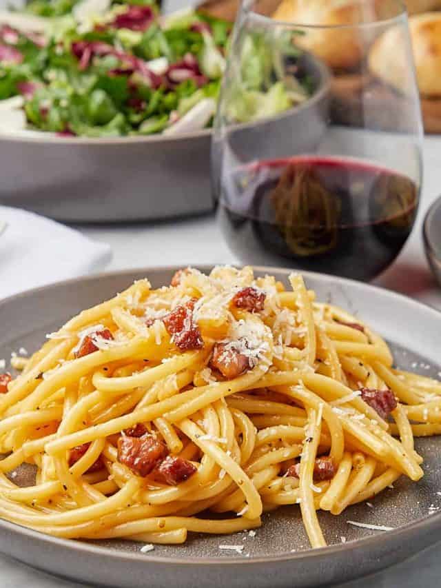 pasta carbonara on a grey plate