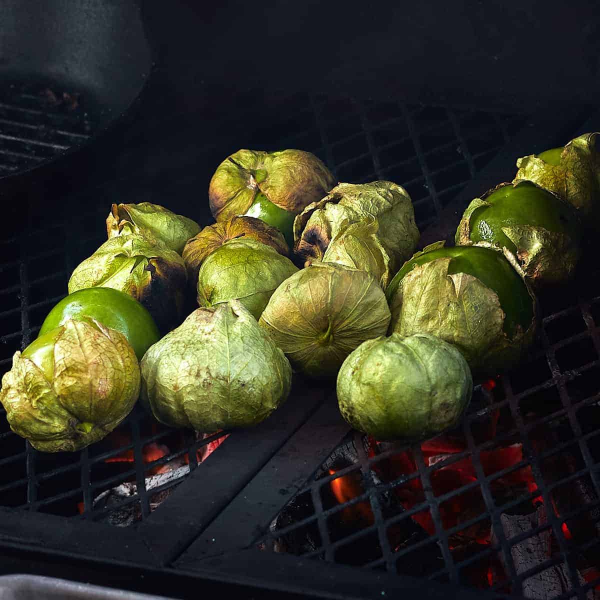 tomatillos being grilled on food fire flame