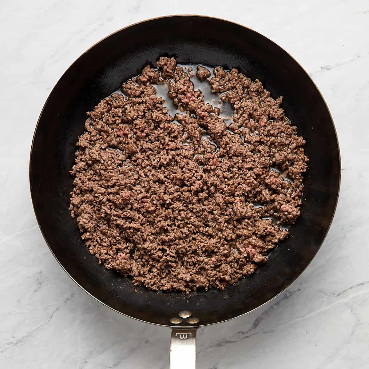 cooked ground beef in a pan