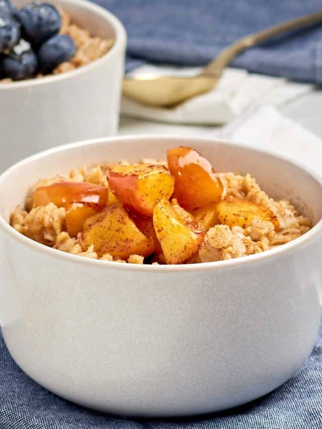 cinnamon spice oatmeal in a bowl topped with cinnamon apples