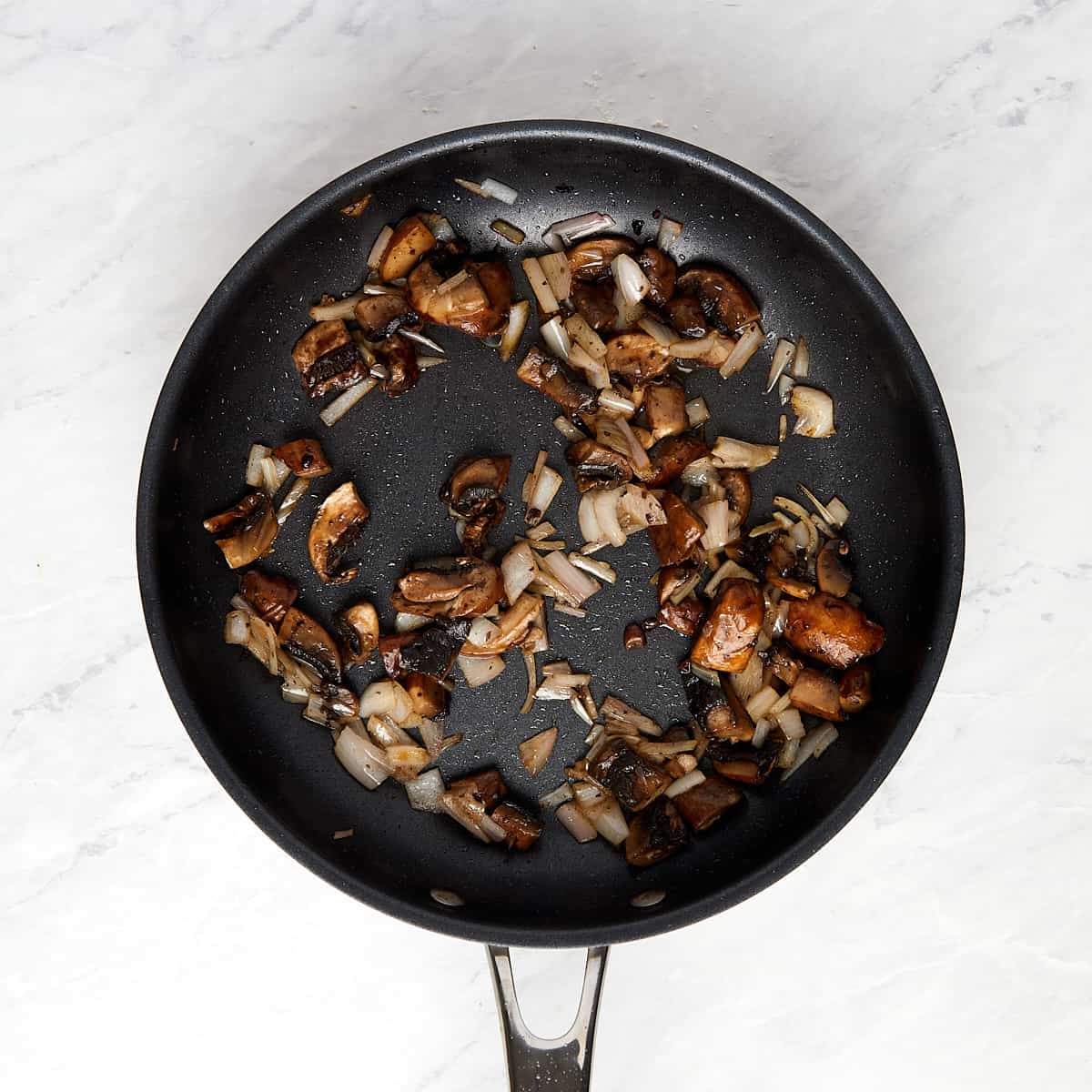 sautéed mushrooms and shallots in a skillet