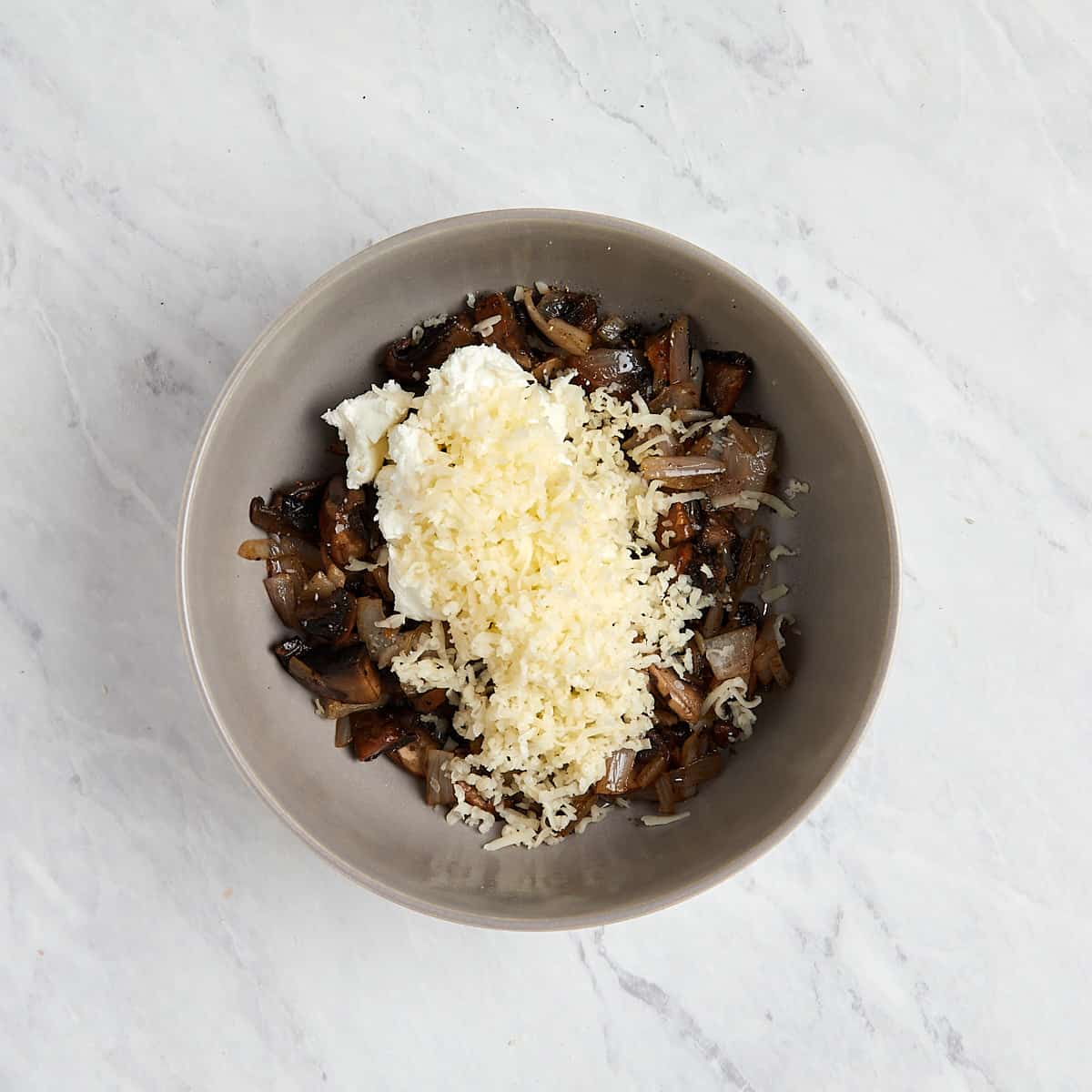 mushroom, shallot, and cheese in a bowl that has not been combined