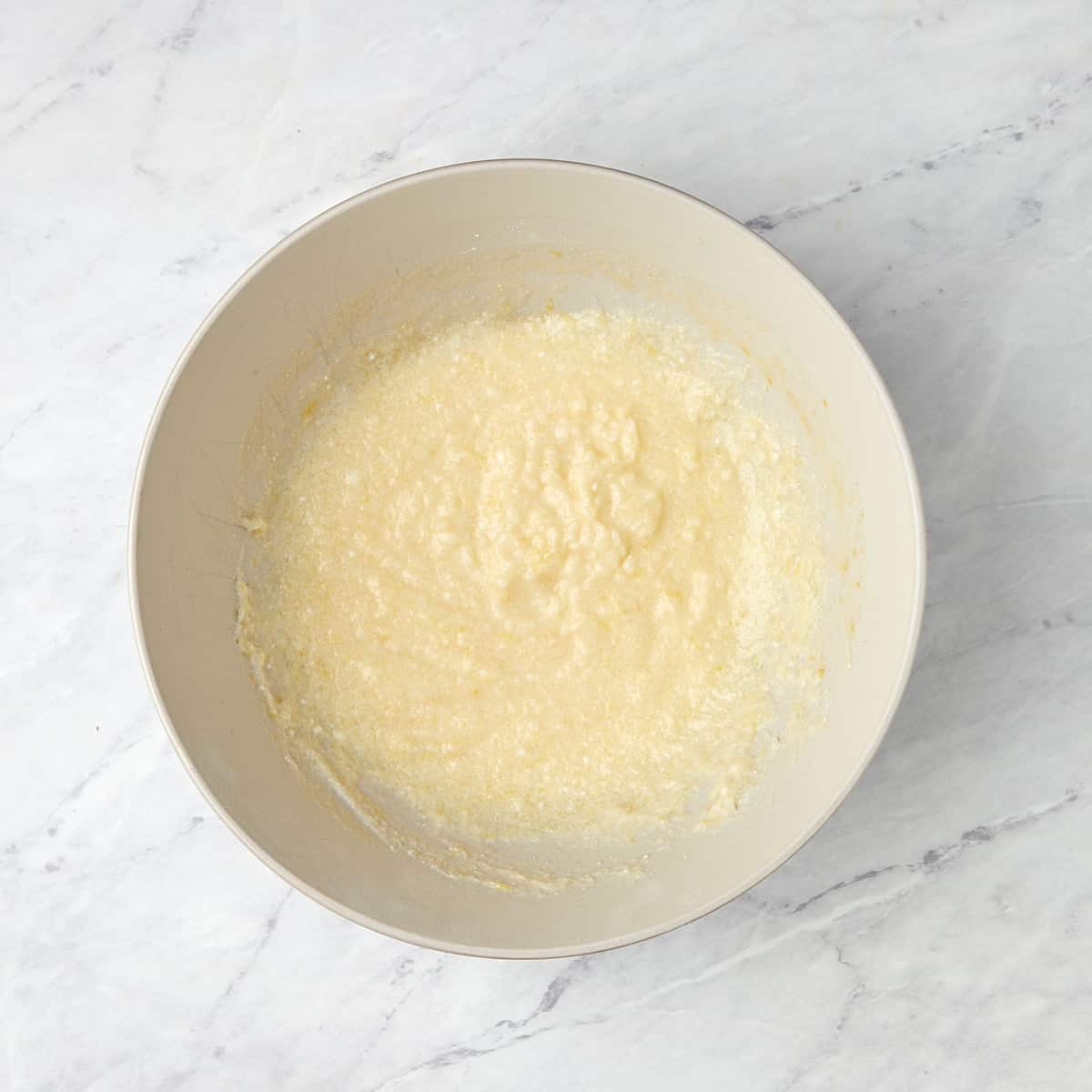 ricotta cheese, butter, lemon sugar, lemon juice, and vanilla in a bowl.