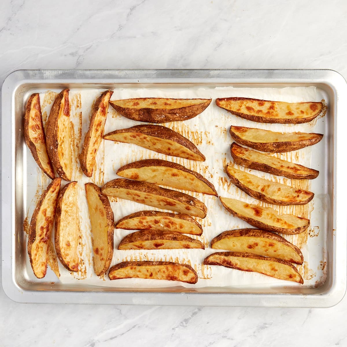 baked wedges on a cookie sheet without toppings.