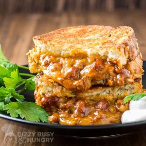 chili cheese grilled cheese on a plate.