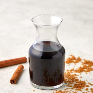 brown sugar cinnamon simple syrup in a glass container.