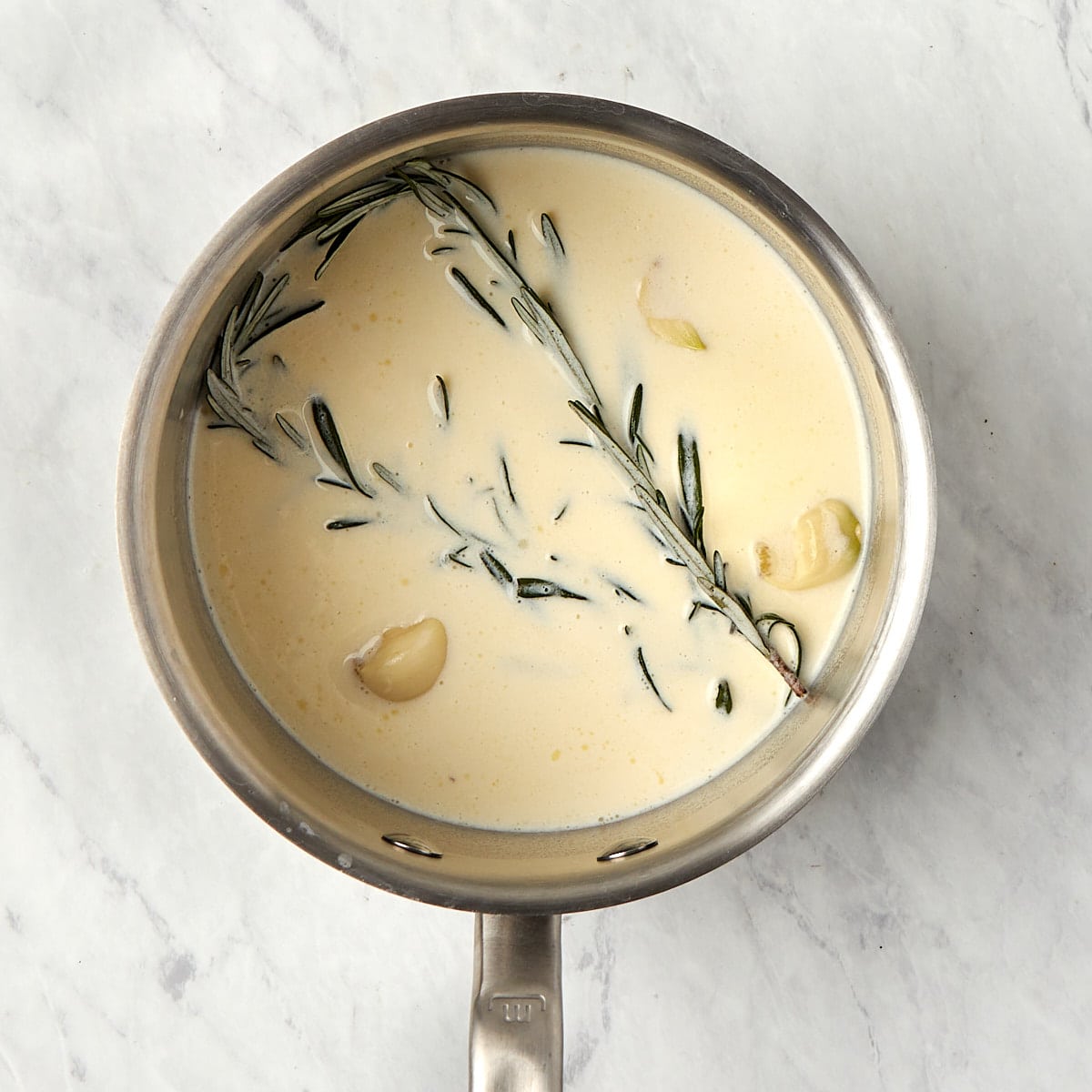 rosemary, garlic, cream, and butter in a small saucepan.