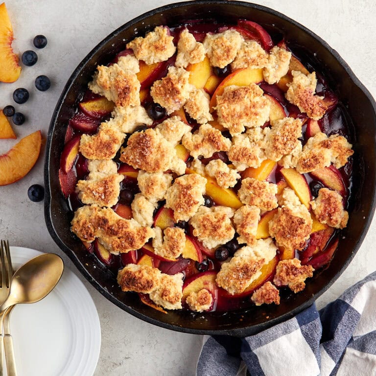 baked blueberry peach cobbler in the cast iron skillet.