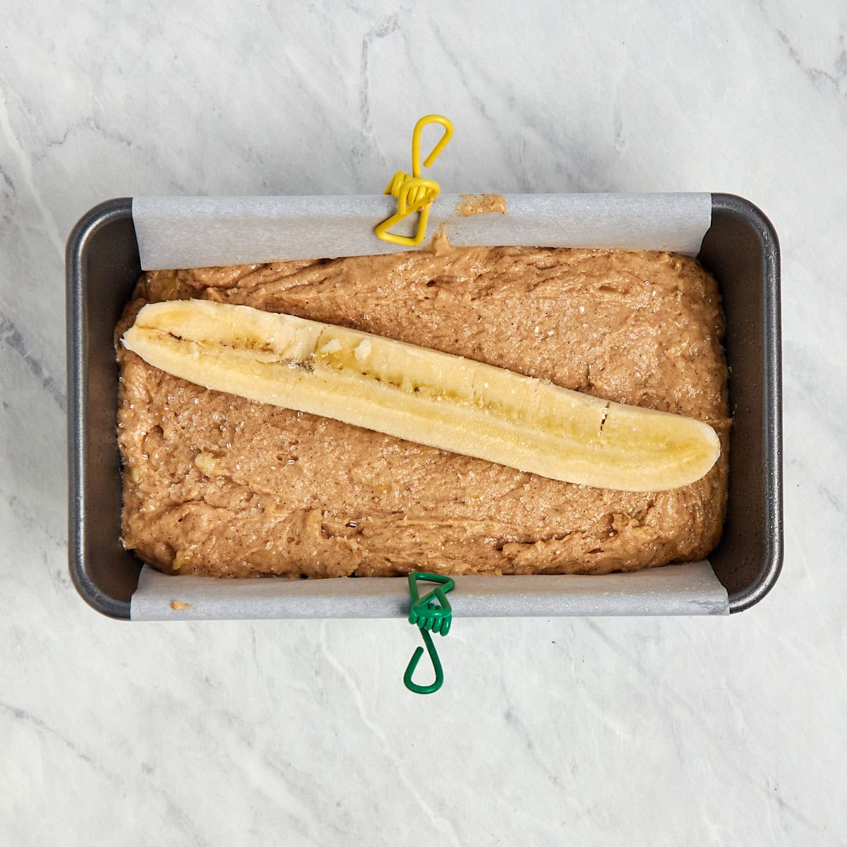 unbaked banana bread in a loaf pan.