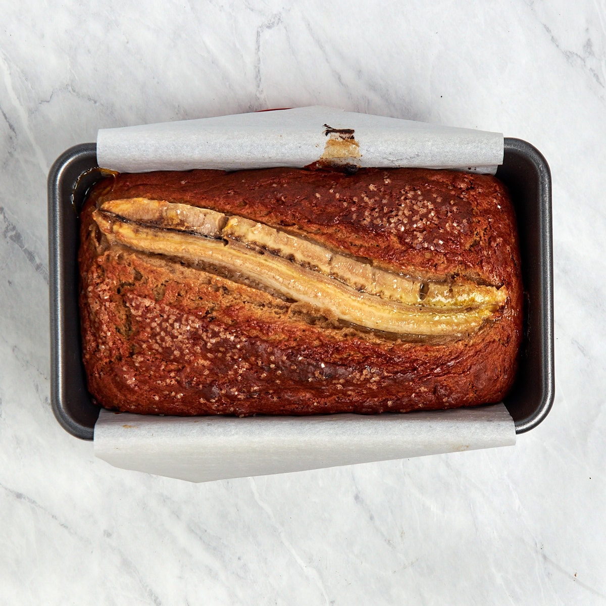 baked banana bread in a loaf pan.