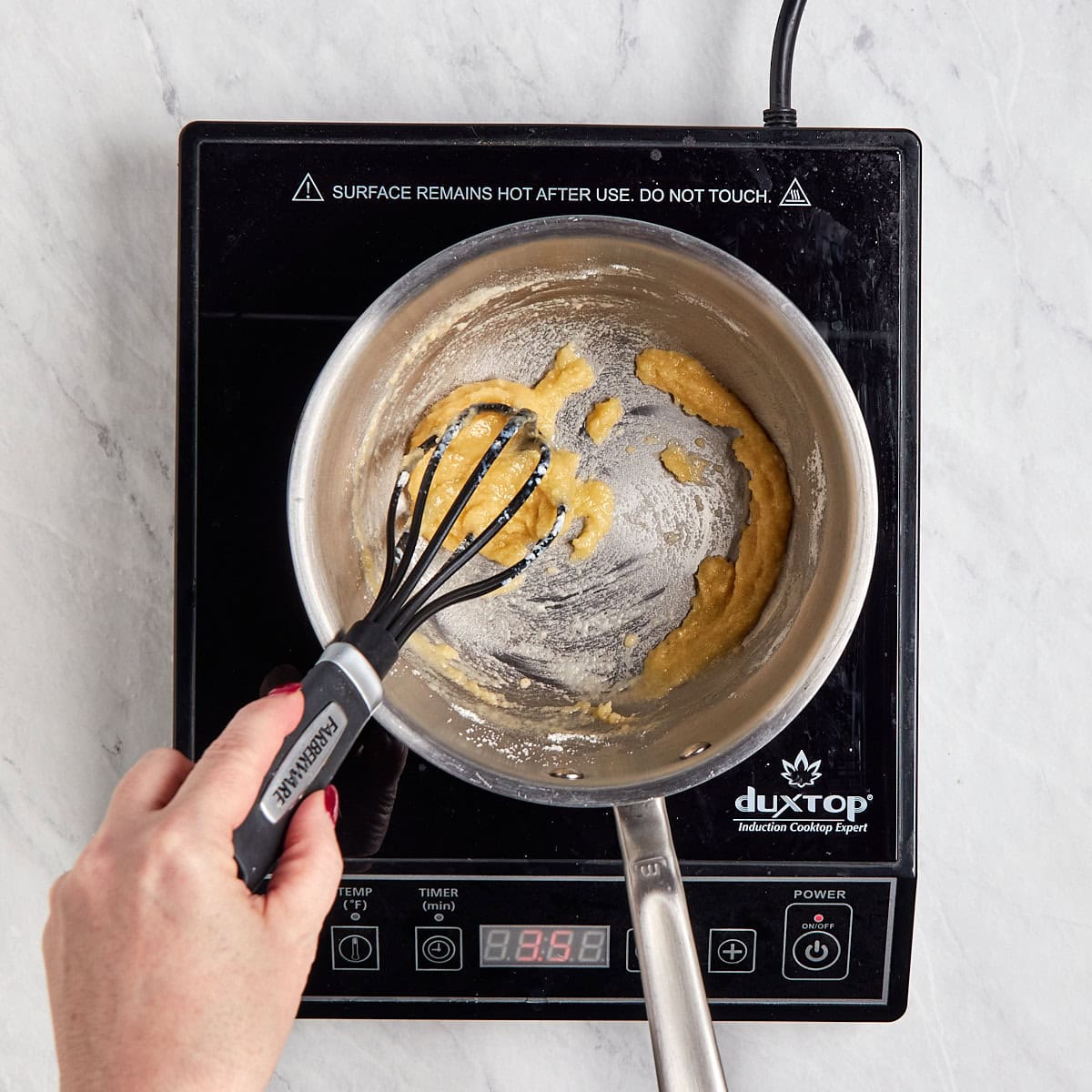 flour being whisked into the butter.