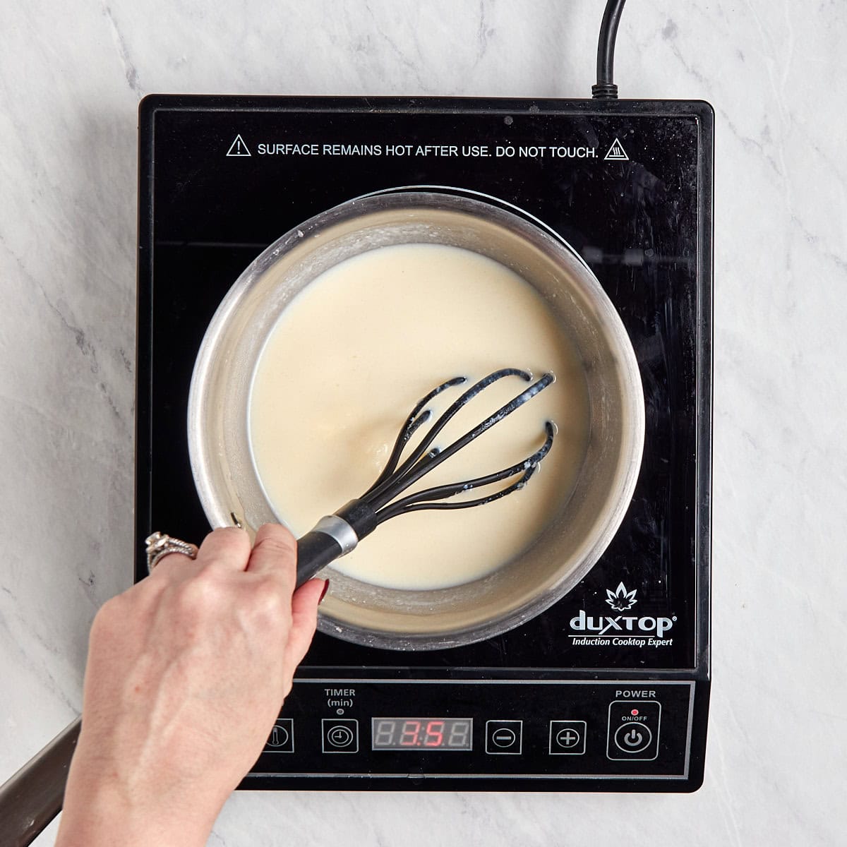 cream base being stirred as it thickens.