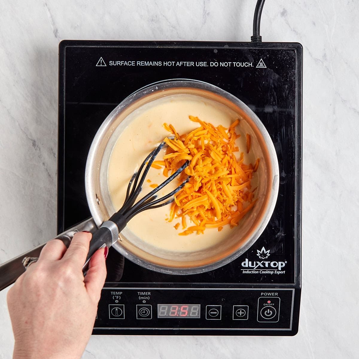 shredded cheese added to the cream base.