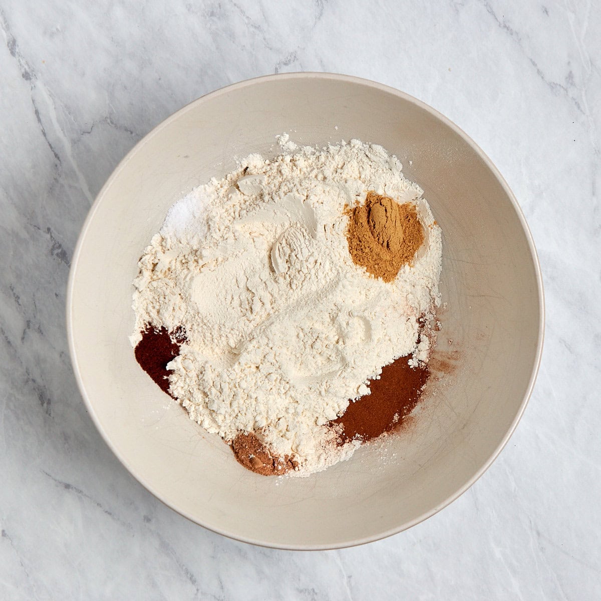 dry ingredients for ginger cookies in a bowl.
