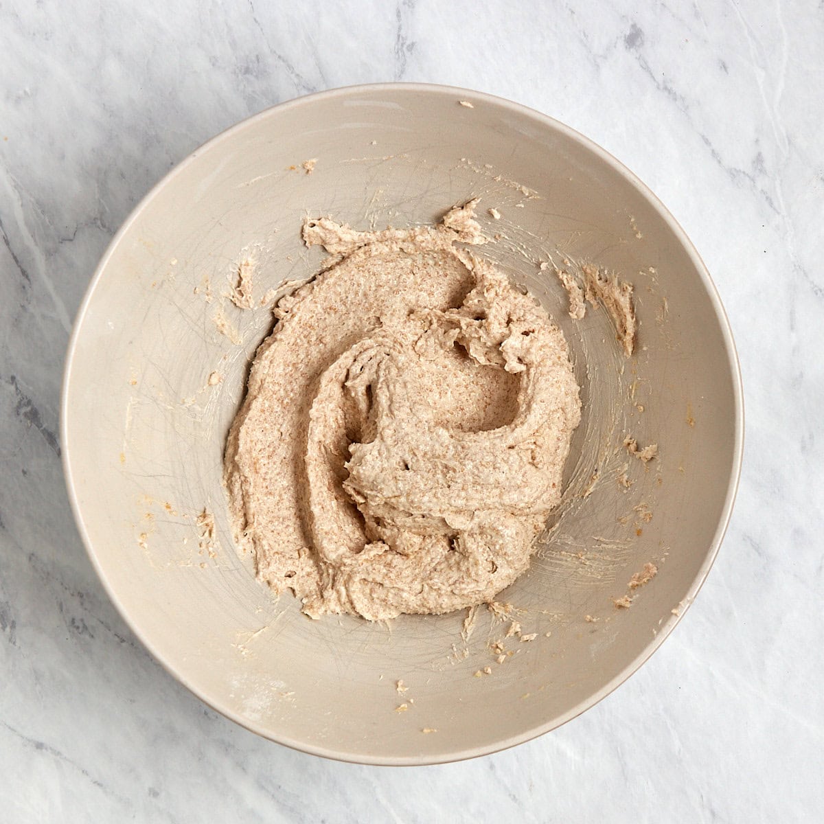 sugars and brown butter creamed together in a bowl.