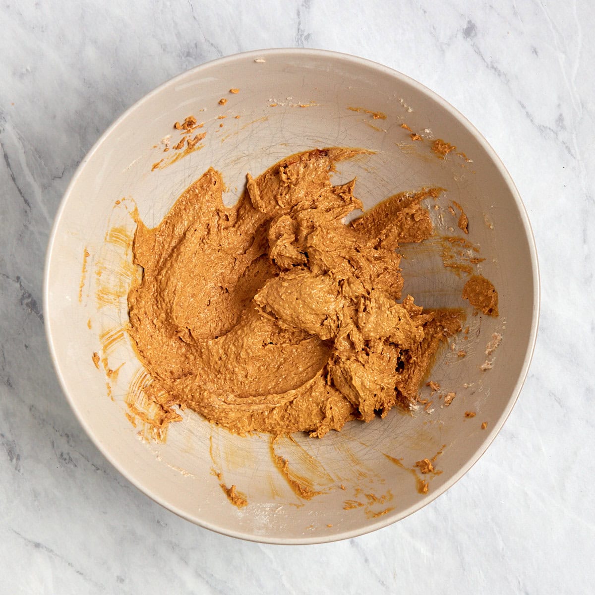 sugars, brown butter, and molasses combined in a bowl.