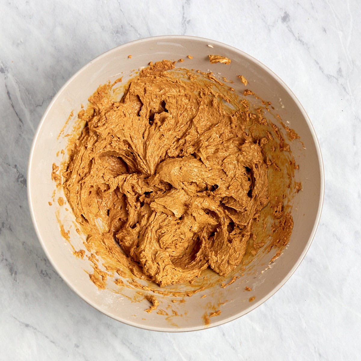 wet ingredients for ginger molasses cookies in a bowl.