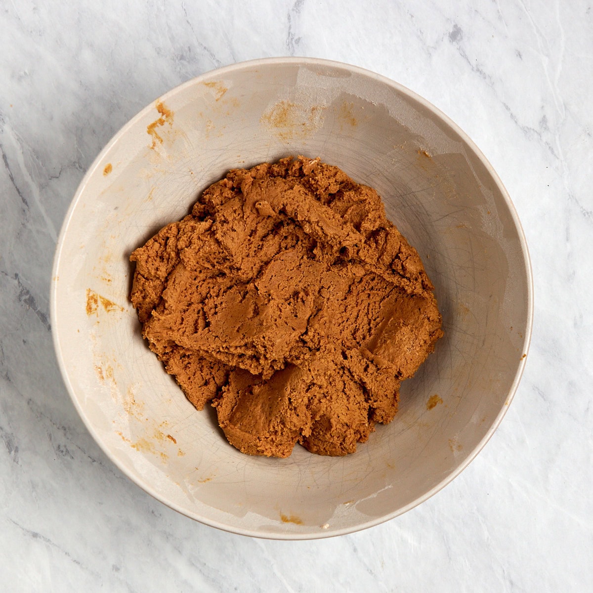 raw ginger cookie dough in a bowl.