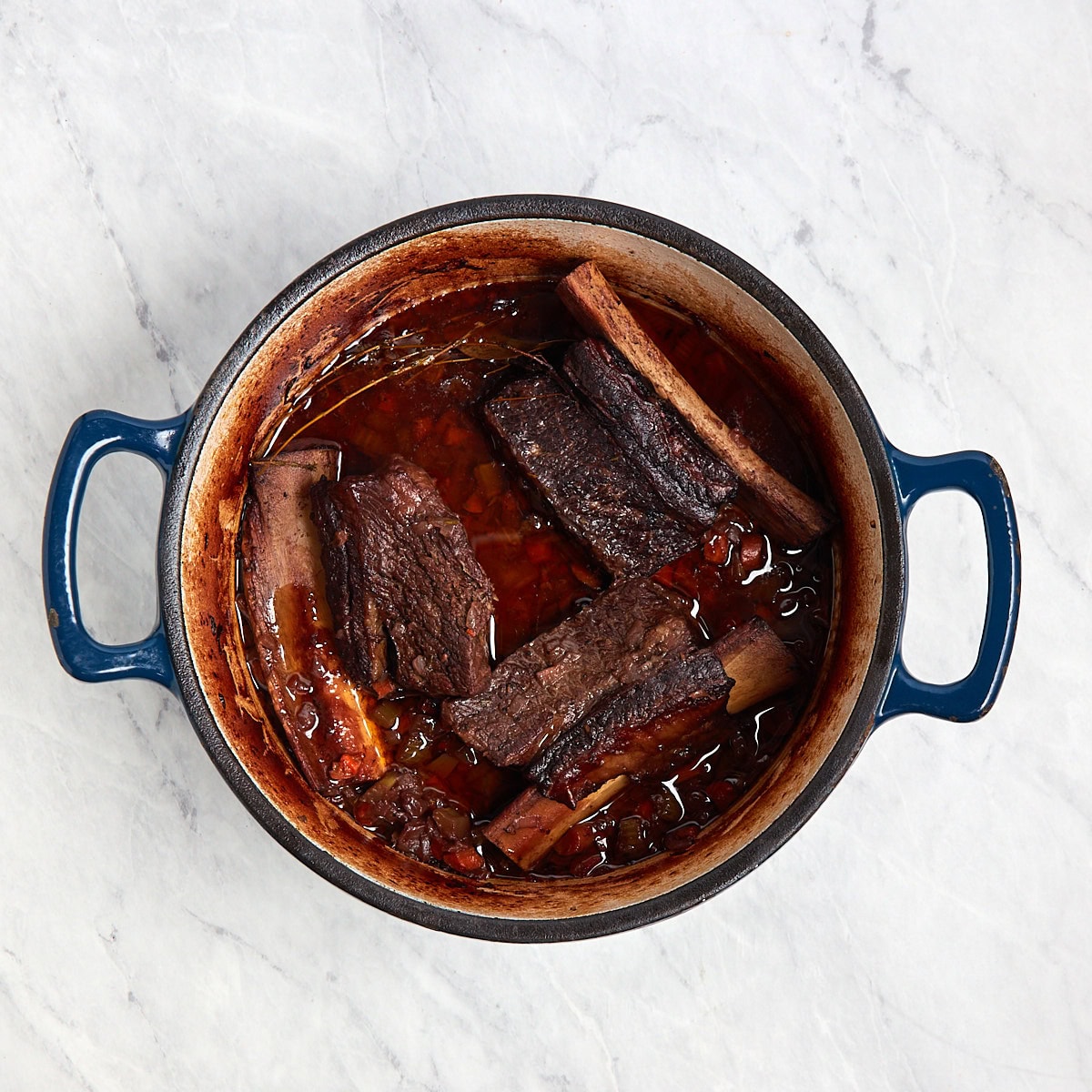 short ribs in a Dutch oven after braising.