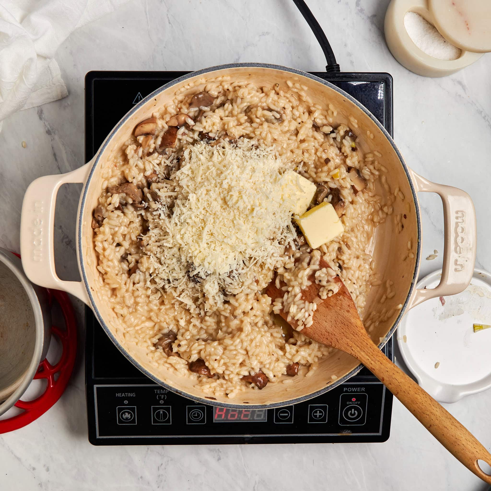 sautéed mushrooms, cheese, and butter added to the braiser with the risotto.