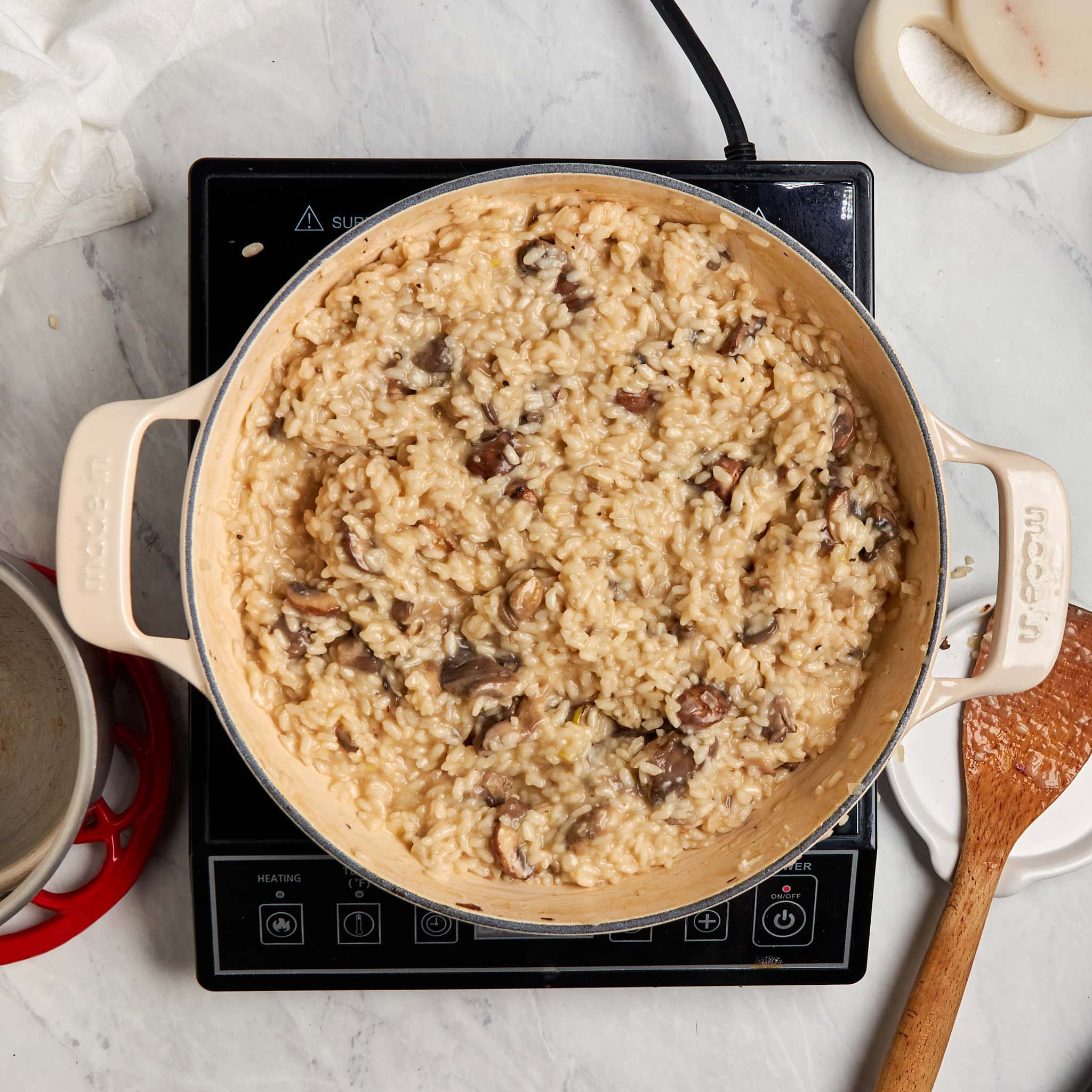 finished mushroom truffle risotto in a braiser.