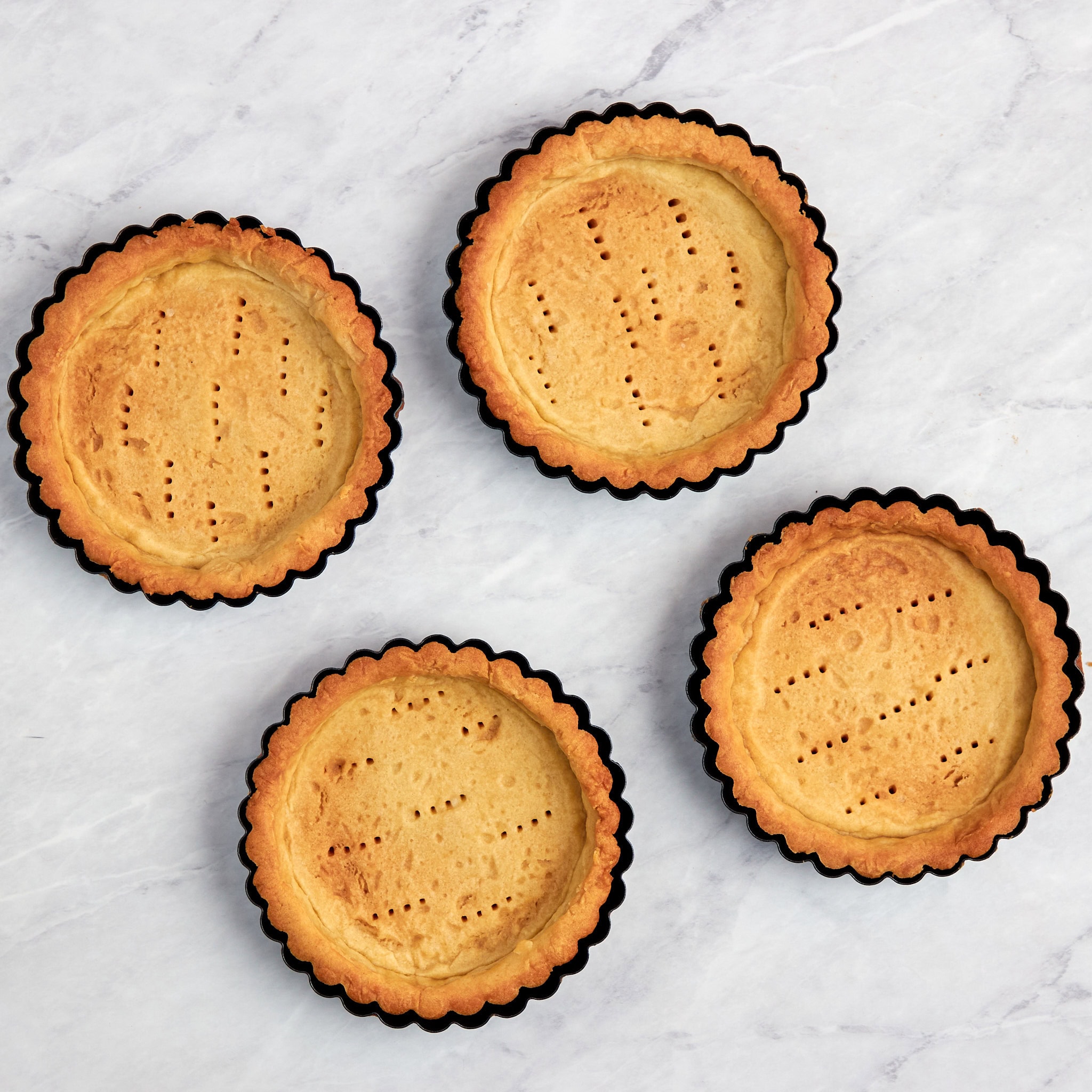 cooked crust in a tart pan.