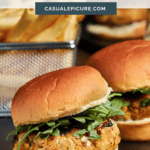 Delicious crab cake sliders with fresh greens on soft buns, perfect for appetizers or casual meals.