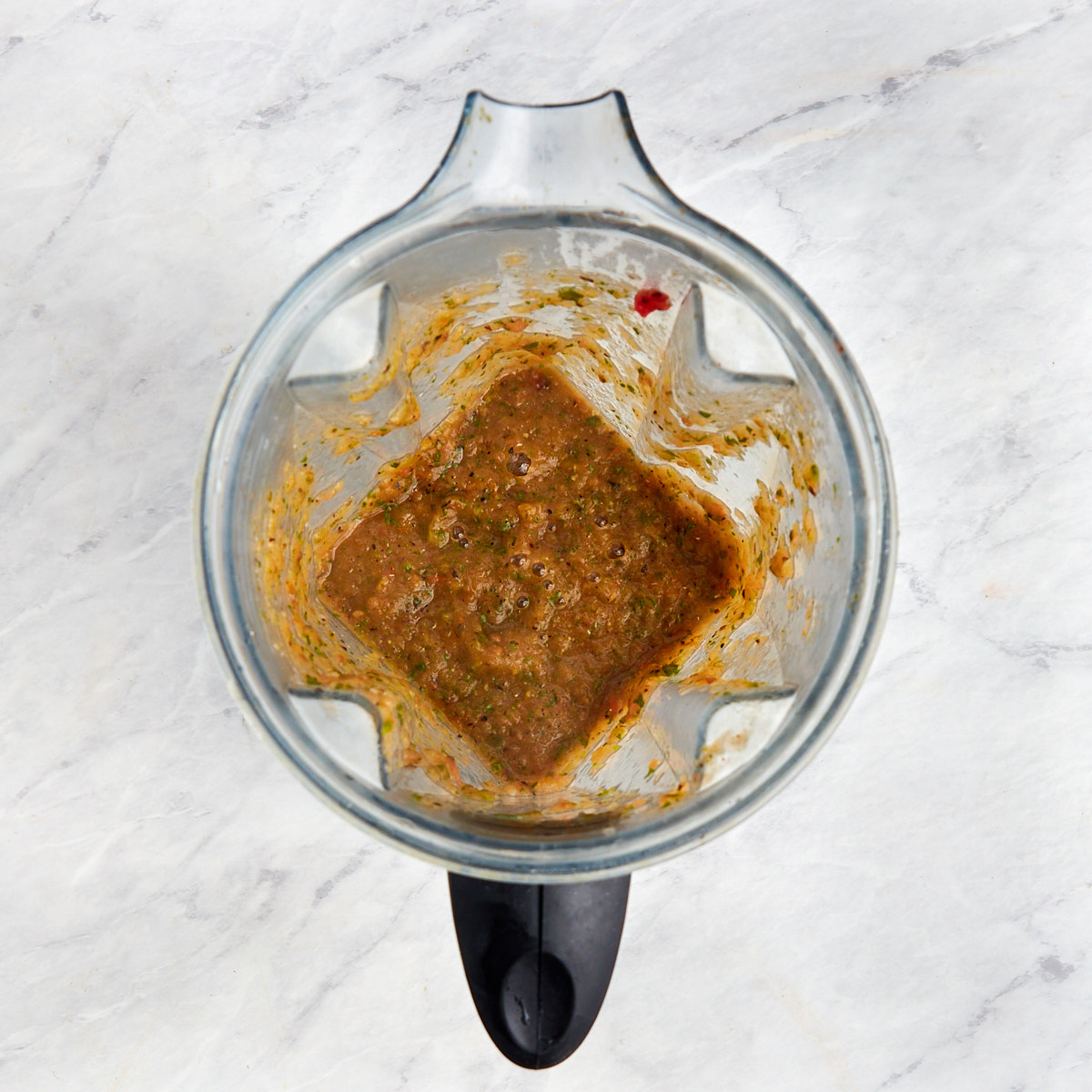 salsa ingredients being blended.