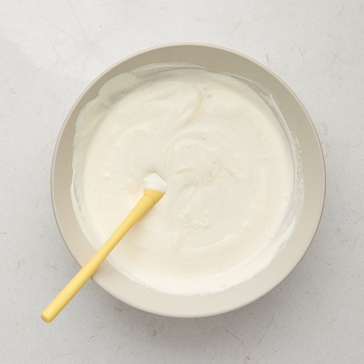 condensed milk, whole milk, corn syrup, sugar, and vanilla added to the bowl with the whipped heavy cream.