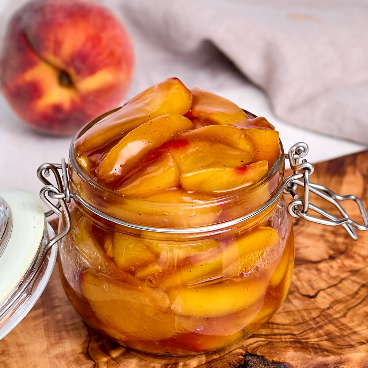 peach pie filling in a glass storage container.