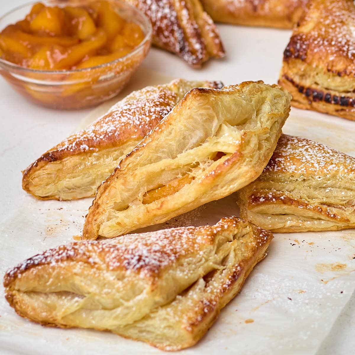 peach turnovers stacked on each other.