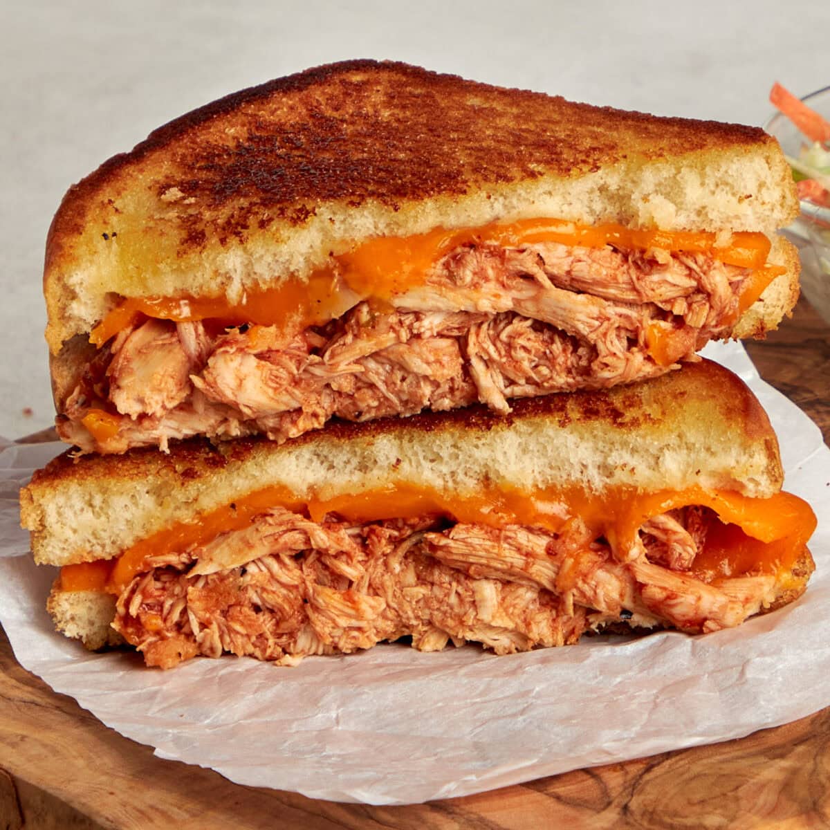 bbq chicken grilled cheese sliced on the diagonal and stacked.