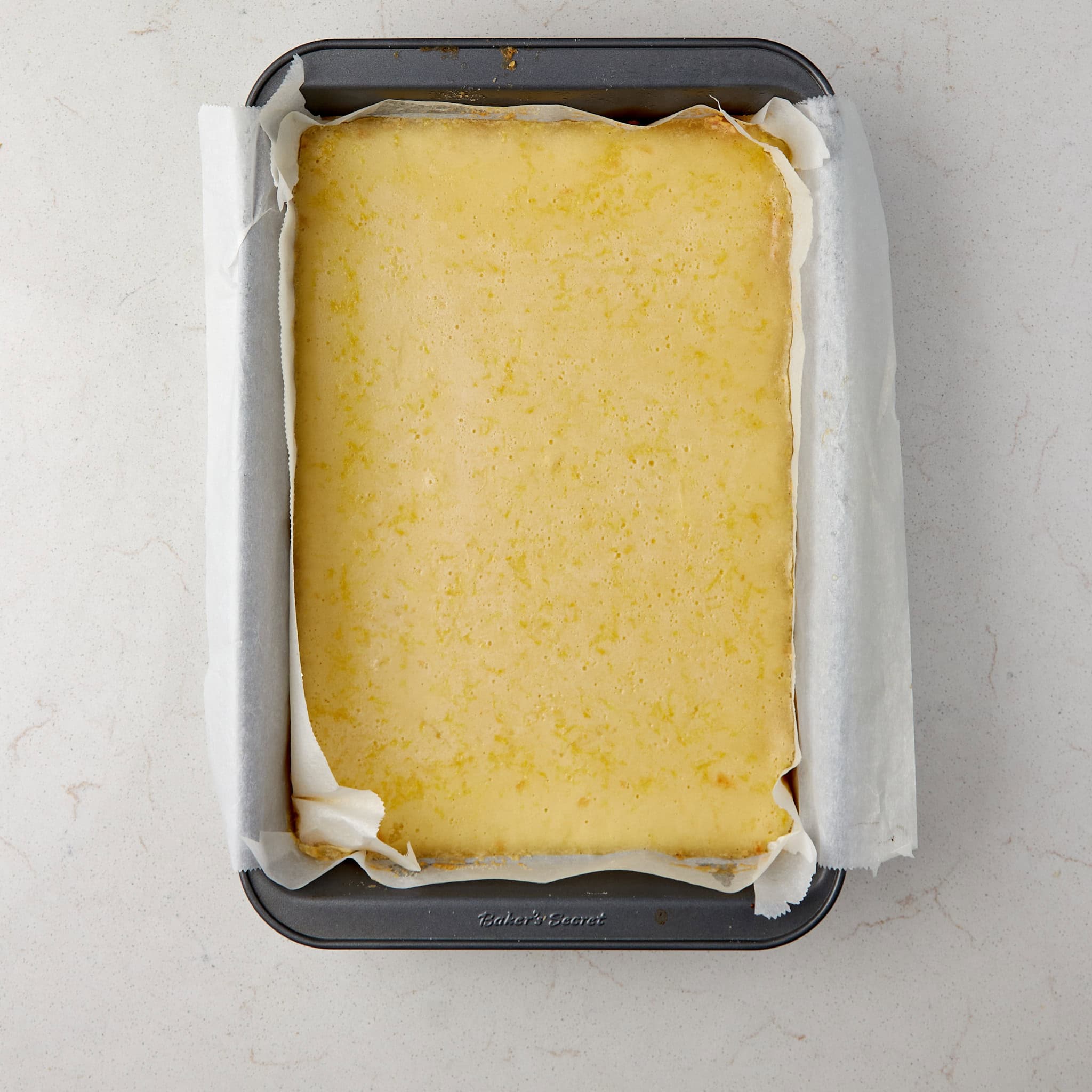 baked lemon bars still in the pan.