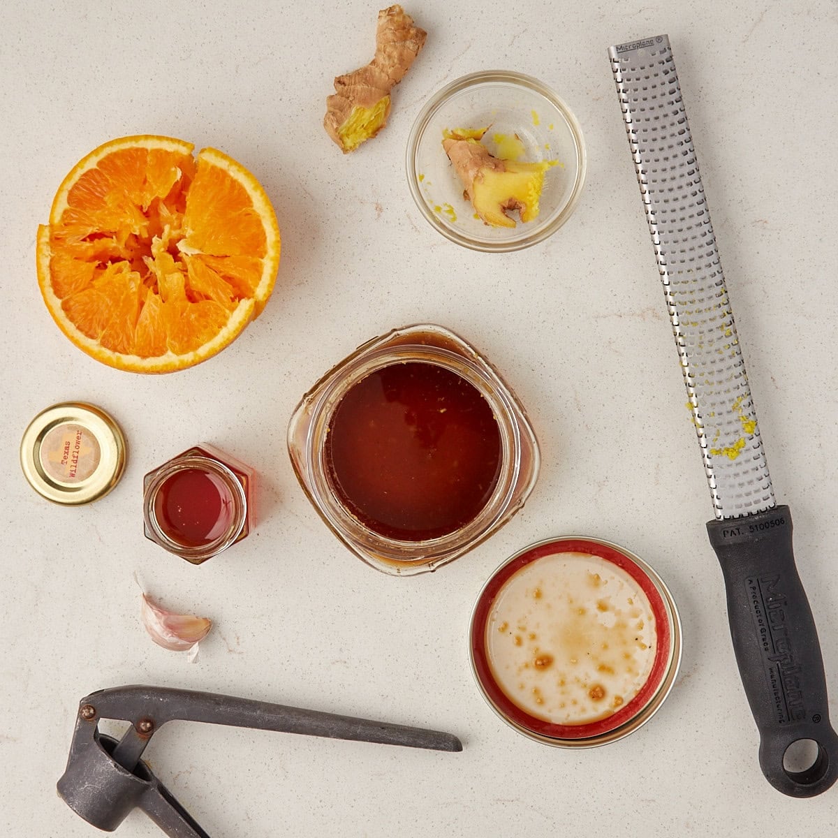 dressing in a small glass bowl with ingredients.