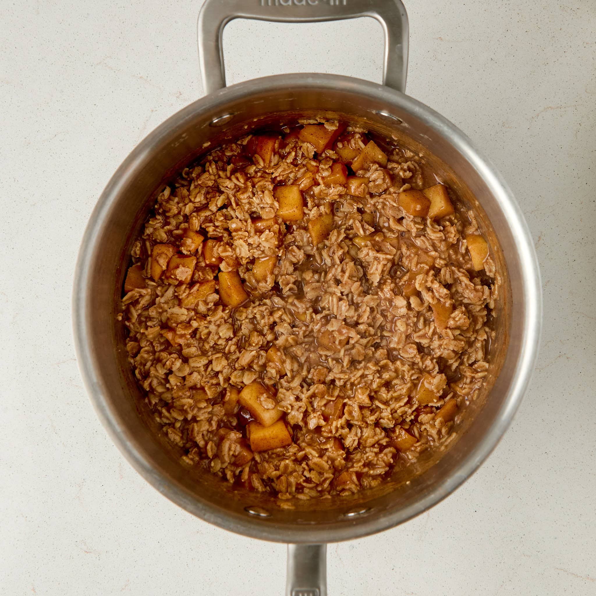 apple pie oatmeal in a saucepan.