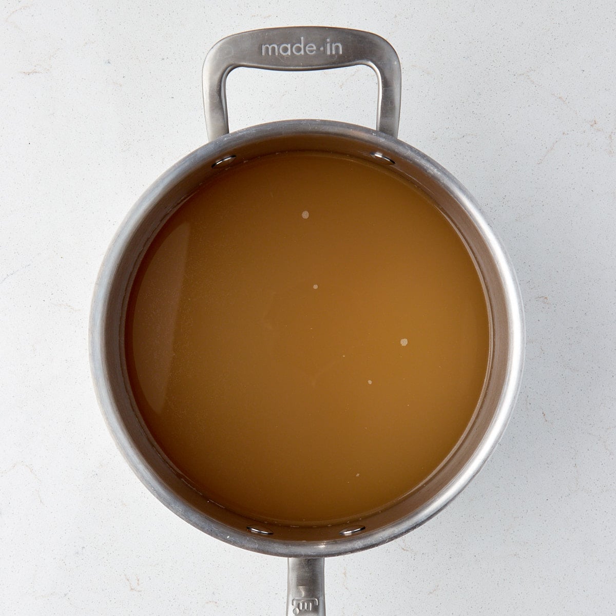 chicken stock in a saucepan.