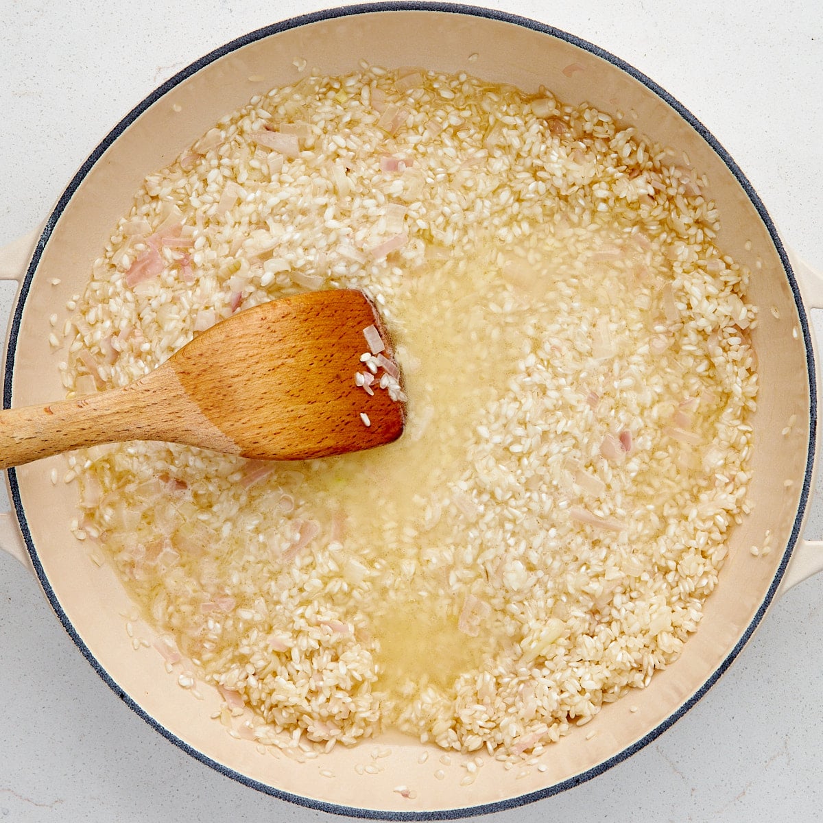 white wine added to arborio rice and shallots.