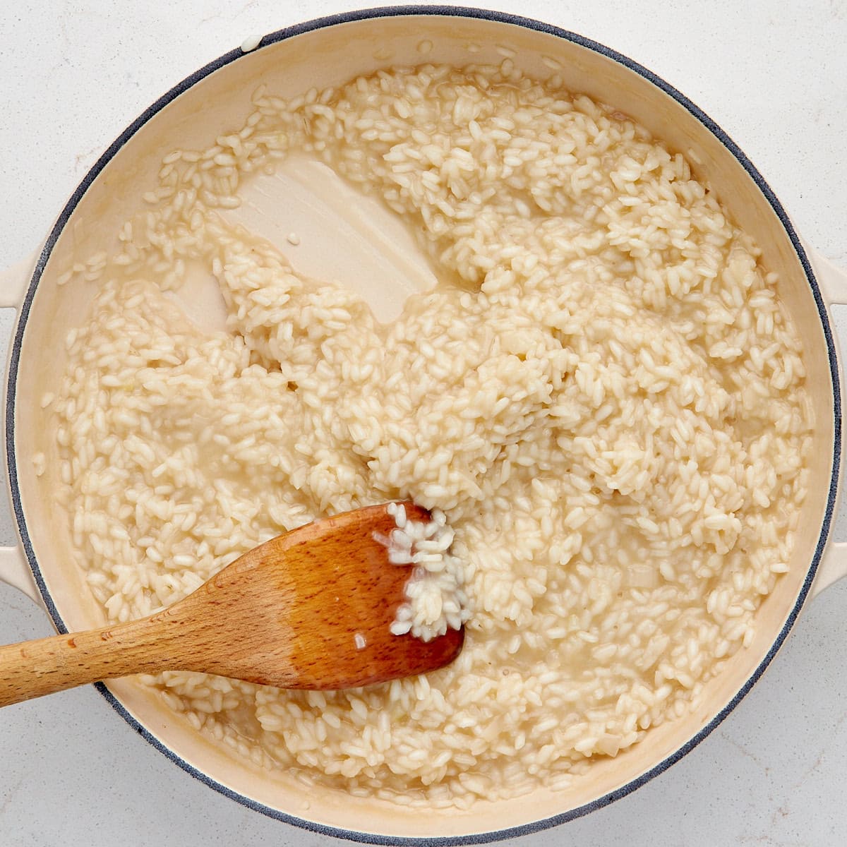 arborio rice cooking with chicken broth.