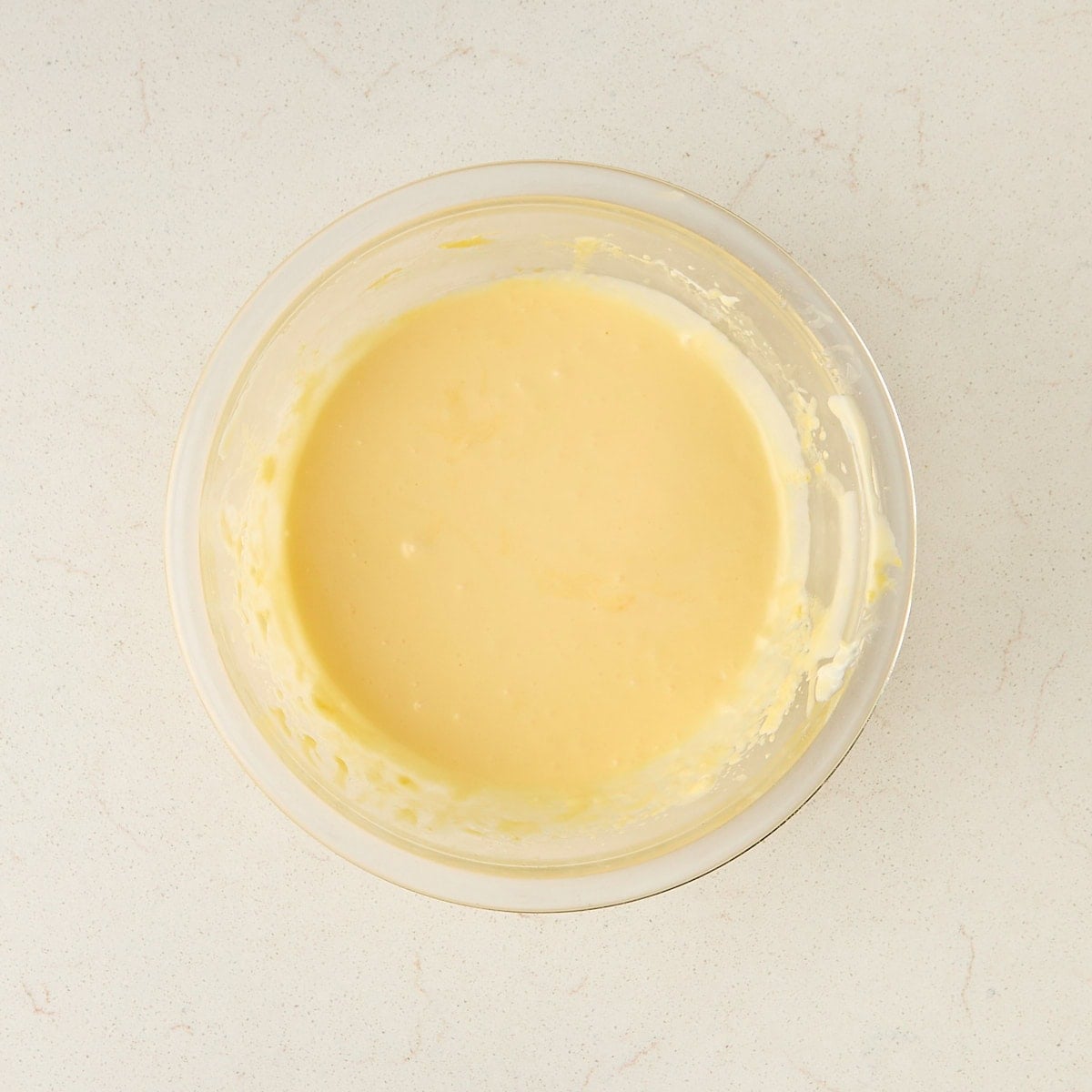 egg yolks, sugar, and mascarpone cream in a bowl